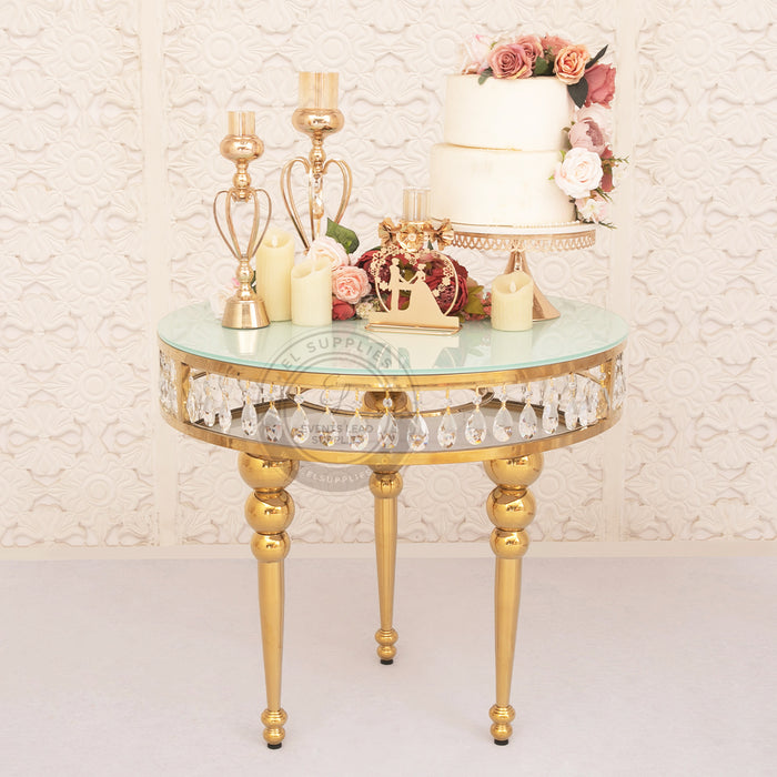 Gemma Thaljy gold cake table with glass top and crystal trim elegant wedding cake display