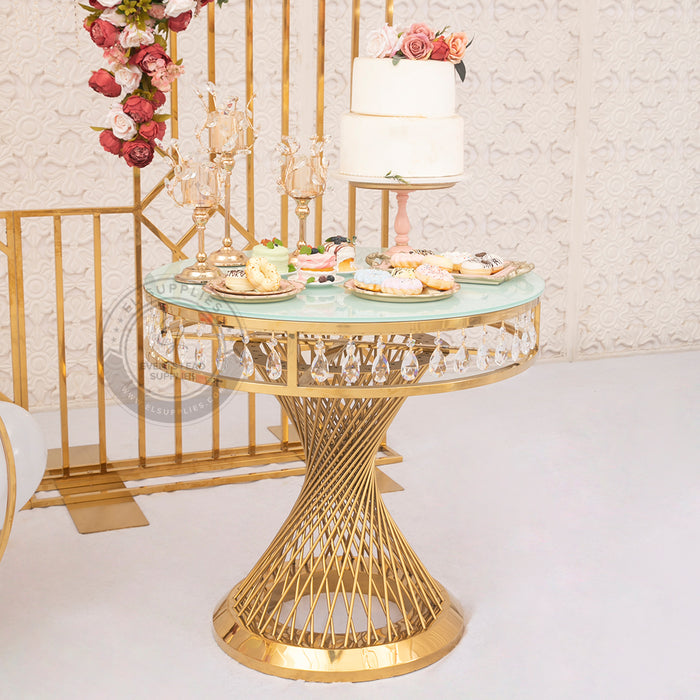 GEMMA VORAGE Cake Table with twisted stainless steel rod base and tempered white glass top