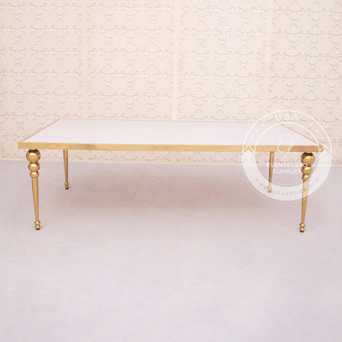 event dining table with white top and gold legs 